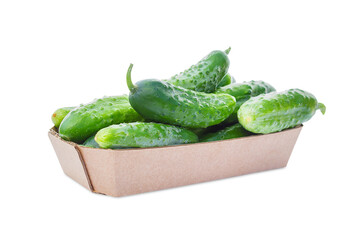 A basket with cucumbers on a white background