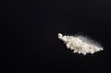 White drug on a black background