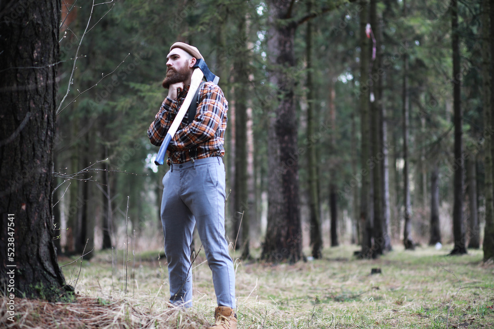 Wall mural a bearded lumberjack with a large ax