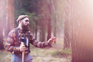 A bearded lumberjack with a large ax