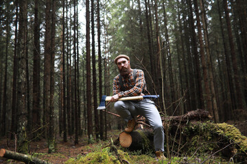 A bearded lumberjack with a large ax