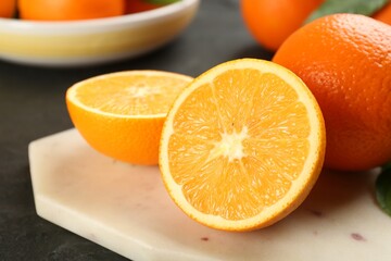 Delicious ripe oranges on white board, closeup