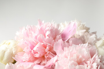 Beautiful peony bouquet on light background, closeup