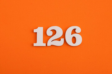 Number 126 - On orange foam rubber background