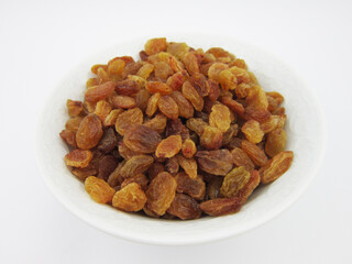      A bowl of yellow golden raisins                  
