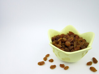  A bowl of yellow golden raisins   