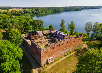 Stare Drawsko, Poland August 16 2022: Ruins of the Castle of the Templati Drahim on Lake Drawsko - obrazy, fototapety, plakaty