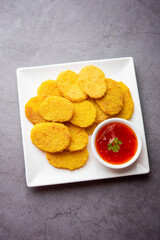 crispy potato rava fried slices or batatyache kaap or batata semolina fry snacks from India