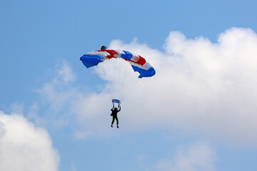 	
Skydiver flying wing in a blue sky	