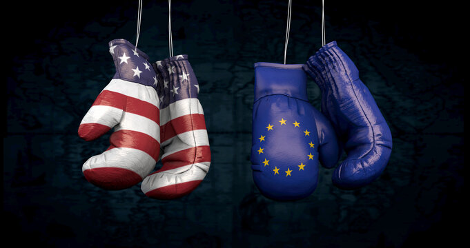 Hanging boxing gloves with the flag of the United States of America and the flag of the European Union illustrate the tensions between the two countries