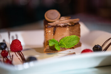 chocolate cheesecake close-up on a white plate
