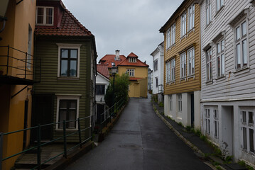 Fototapeta na wymiar Idyllic small street (Knosesmauet) with colorful traditional wooden houses, Bergen, Norway