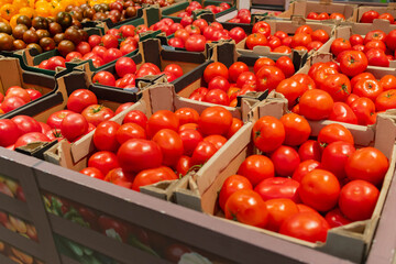 Crates of tomatoes in a supermarket