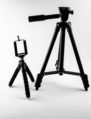 Tripods for the camera, camcorder on a white background. Tripod for smartphone and camera.