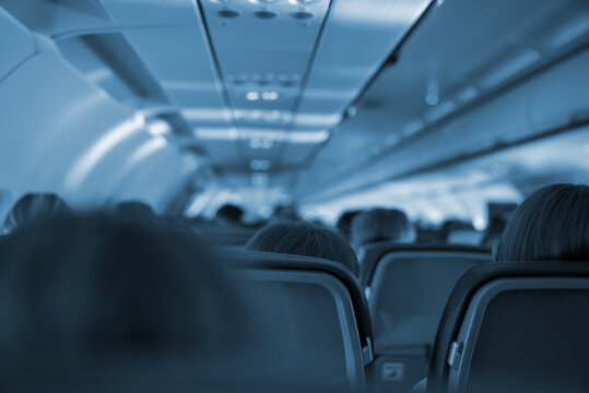 Interior Inside Of The Plane With Passengers.