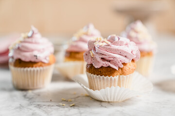 cupcakes with whipped butter cream blackberry strawberry lemon cake