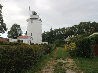 White lighthouse in countryside in Estonia