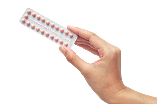 hand holding Oral contraceptive pill isolated on white background