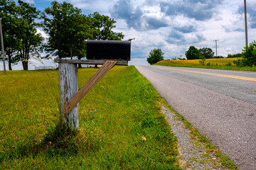 Pastoral scene of rural mailbox on a country road. 