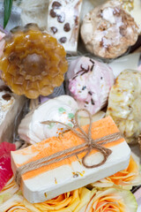 Colorful hand made soaps and soap bars in boxes and baskets beautifully arranged and designed as gifts