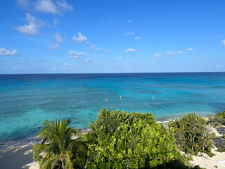 An aerial view of Cemetery Beach on Seven Mile Beach in Grand Cayman Island on a beautiful sunny day.