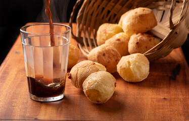 Cheese bread, beautiful cheese breads on rustic wood and a cup of hot coffee. selective focus.
