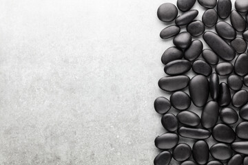 Spa massage stone theme on grey background.