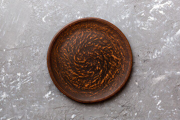 Top view of empty plate on cement background. Empty space for your design