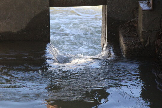 water gurgling through a brick wall