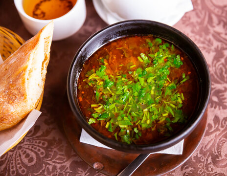 Traditional soup of Georgian cuisine Kharcho from beef meat in a plate