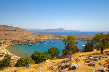 View of the Lindos beach and surrounding landscape of east cost Rhodes island near of Lindos town, Greece, Europe. - obrazy, fototapety, plakaty