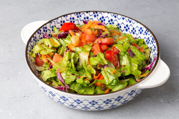 Turkish cuisine with lettuce salad, purple cabbage and tomato
