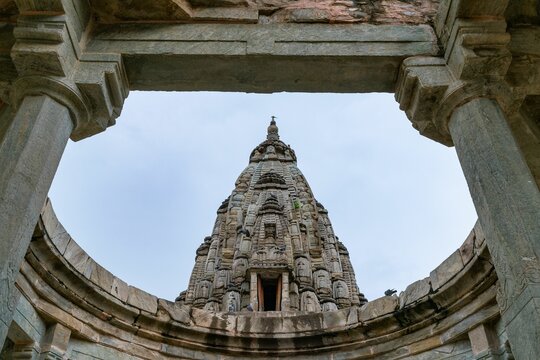 Low angle shot of the Rameshwar Temple seen from an arched structure, Jaipur, India