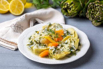 A dish with olive oil from Turkish Aegean cuisine; artichoke dish with rice and olive oil (Turkish name; zeytinyagli enginar)