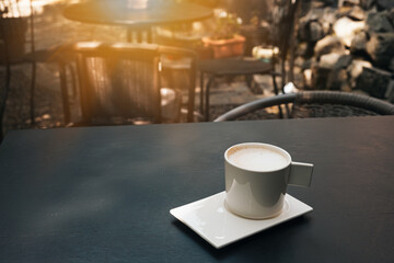 cup of coffee on table in cafe , Morning light