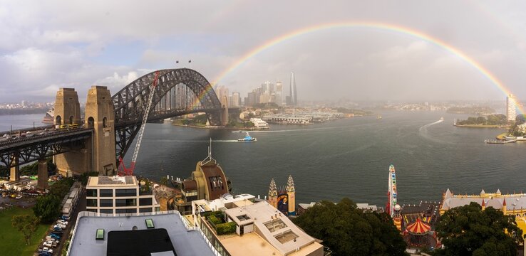 Beautiful, panoramic view of a rainbow over the Sydney Harbour Bridge in Sydney, Australia