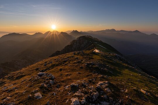 Picturesque sunrise of an alpine valley ,on Karavanke mountain range, Begunjscica 2060m ,Slovenia