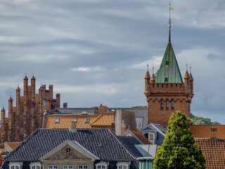 Gorgeous high medieval tower built in brownstone with a green roof in Helsingor, Denmark © Wirestock Creators