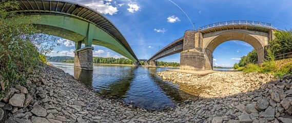 Wide-angle shot of a modern and a historic bridge over the Rhine
