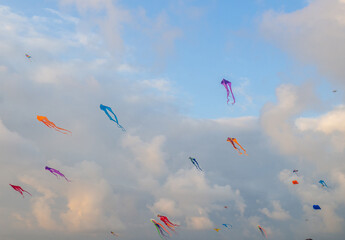 Lots of kites in the sky. Kite Festival. Colorful toys. Launching kites. Beauty in the sky Leisure entertainment.