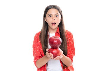 Teenager child girl biting tasty green apple.