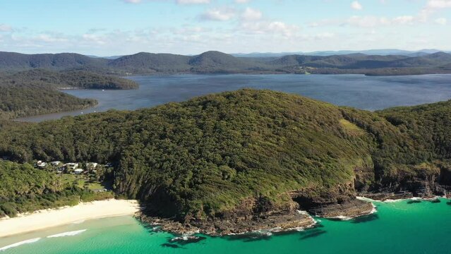 Wood covered hill ranges of Booti Booti nat park in Australia &ndash; aerial 4k.

