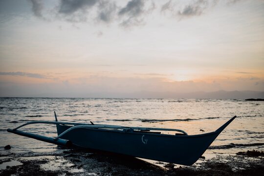 Boat on the beach of Romblon, the Philippines, at sunset