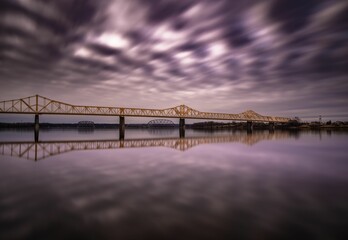 Long exposure shot of a purple sunset sky over the bridge of Ohio River