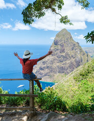 Asian women hiking in the mountains of Saint Lucia Caribbean, nature trail in the jungle of Saint...