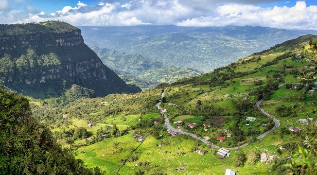 Aerial view of houses on a green hill in Choachi, Colombia