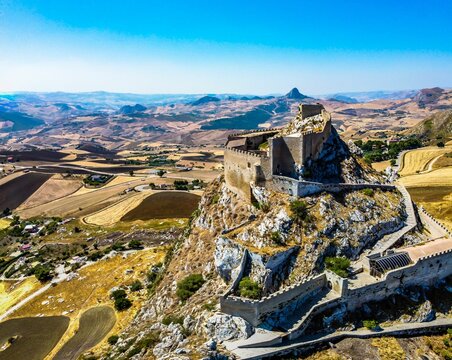 Mussomeli castle on the top of a dry hill on a bright sunny day