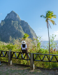 Asian women with a hat and a view at the Pitons of St Lucia Saint Lucia, women hiking in the mountains of Saint Lucia Caribbean, and nature trail in the jungle of Saint Lucia. 