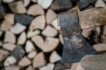 Axe used for fire wood during energy cris - obrazy, fototapety, plakaty