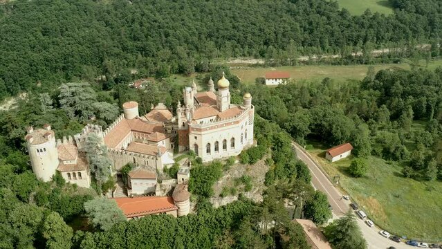 Aerial drone panoramic view of the Rocchetta Mattei castle in Italy on sunny summer day, view from above. High quality 4k footage